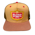 A tan and dusty rose trucker hat with a brown mesh back, featuring a red and yellow 'ALOHA STARTS HERE' patch on the front.