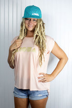 Blond dreadlocked girl wearing Aloha Shapes ® logo womens flowy muscle tee