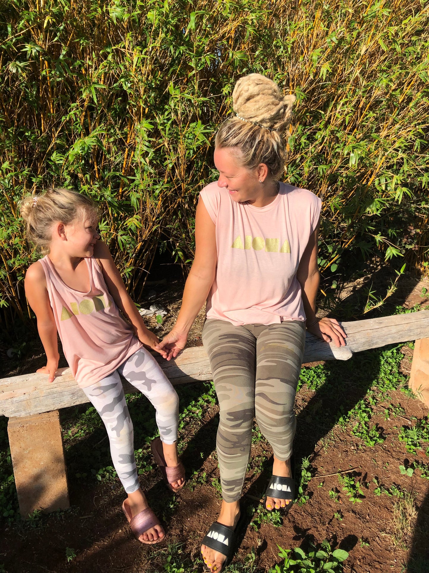 Mother and daughter wearing matching Peach colored Aloha Shapes® apparel