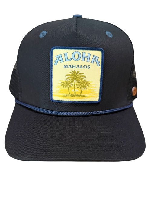 A black trucker-style baseball cap with a rectangular front patch reading 'ALOHA MAHALOS' above a yellow palm tree illustration, shown on a plain white background.