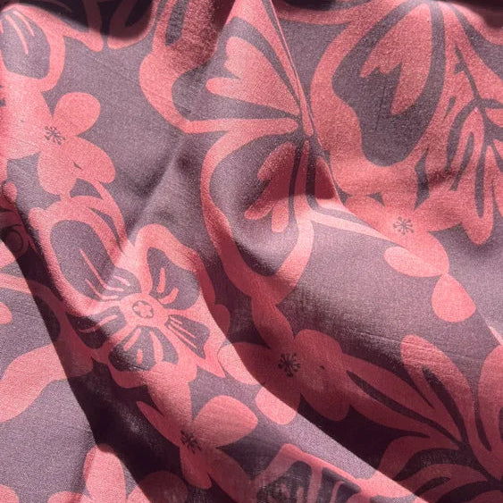 Close-up of fabric with red and black floral pattern