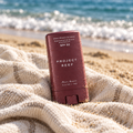 PROJECT REEF sunstick on a beach towel