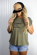 Blond dreadlocked girl wearing a cork Aloha Shapes ® logo snapback hat