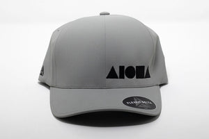 Adult Flexfit ALOHA Shapes ® logo hat. Light Grey waterproof material embroidered with black ALOHA Shapes ® logo