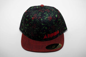 Adult flat brim snapback hat with coffee bean plant printed on black fabric. Red denim brim. Embroidered with red Aloha Shapes ® logo
