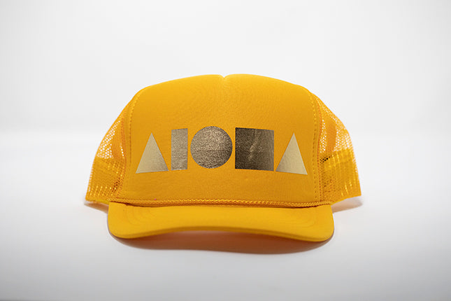 Yellow foam youth trucker hat foil printed with metallic gold Aloha Shapes ® logo 