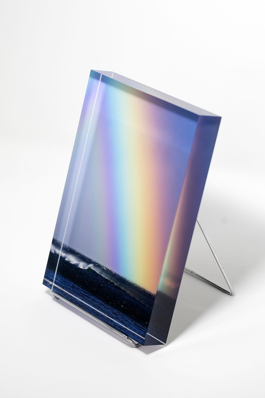 Stu Soley fine art acrylic photo block showing a giant rainbow over the Pacific ocean in Maui Hawaii