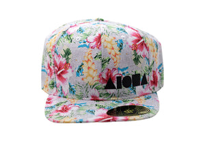 Adult curved bill snapback hat designed on Maui Hawaii with tropical floral print all over
