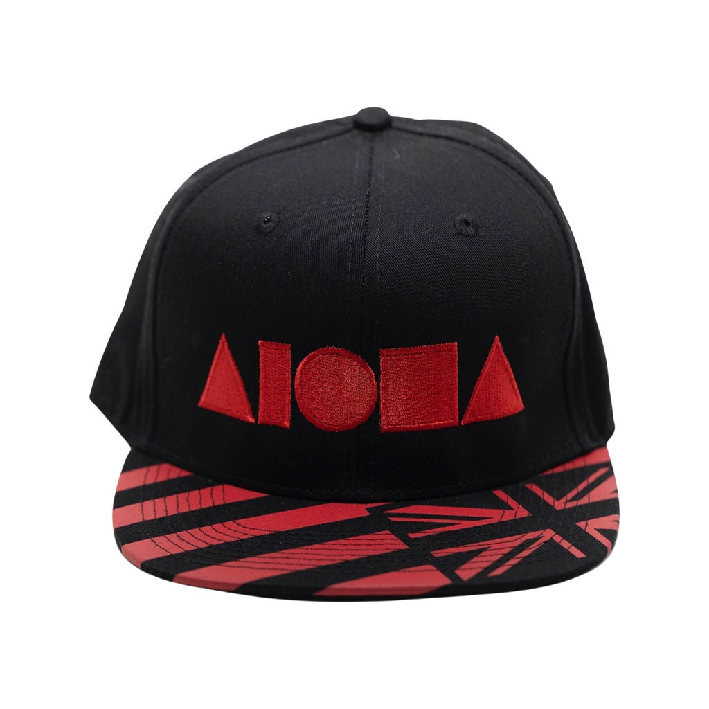 Black and red Hawaiian flag on adult flat brim snapback. Embroidered with large red Aloha Shapes® logo