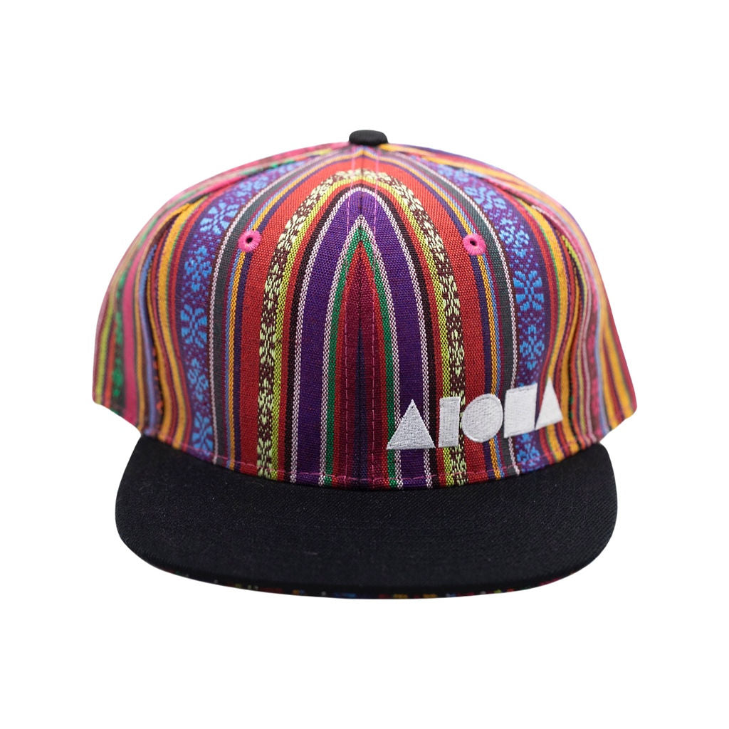 Adult flat brim snapback designed in Maui Hawaii. Multi colored Guatemalan fabric with black brim