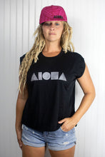 Woman in a black Aloha Shapes® muscle tee wearing a neon pink Aloha Shapes® tribal print adult snapback hat
