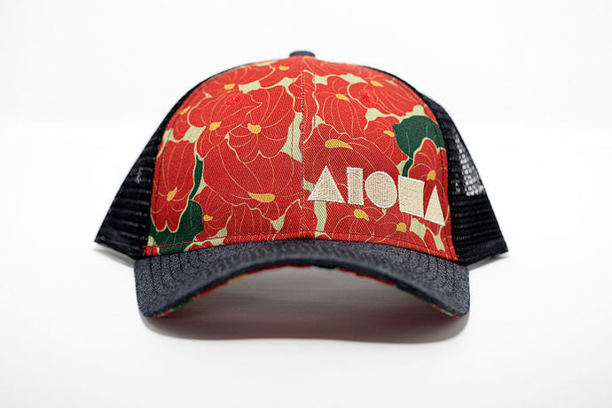 Adult curved bill snapback with anthurium flower printed fabric on front panels. Black mesh back panels