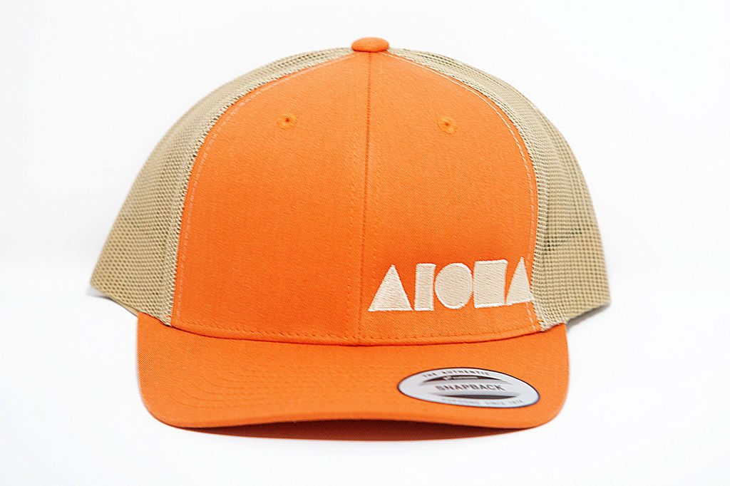 Orange and tan curved bill adult snapback hat embroidered with tan Aloha Shapes logo