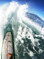 GoPro shot of our black decal sticker on surfboard of someone shredding the gnar