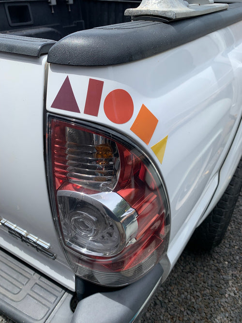 "Sunset Cruise" Aloha Shapes® decal sticker placed on back of car in a an arc over the taillight