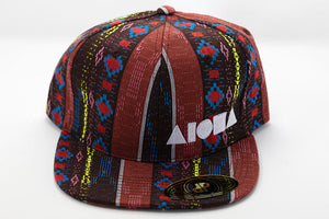 Multi-color striped woven fabric adult flatbrim snapback hat embroidered in Maui Hawaii with white Aloha Shapes logo