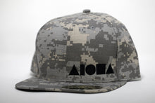 Adult flat brim snapback hat. Greyscale digital camo print fabric with black embroidered Aloha Shapes® logo.