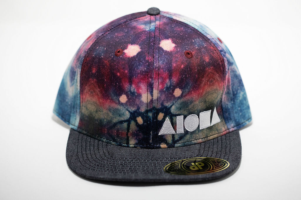 Tie-dye pattern adult flat brim snapback hat embroidered with white Aloha Shapes ® logo