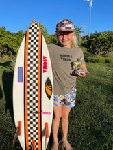 Girl wearing INpinknito adult flatbrim snapback hat showing off her surf contest trophy
