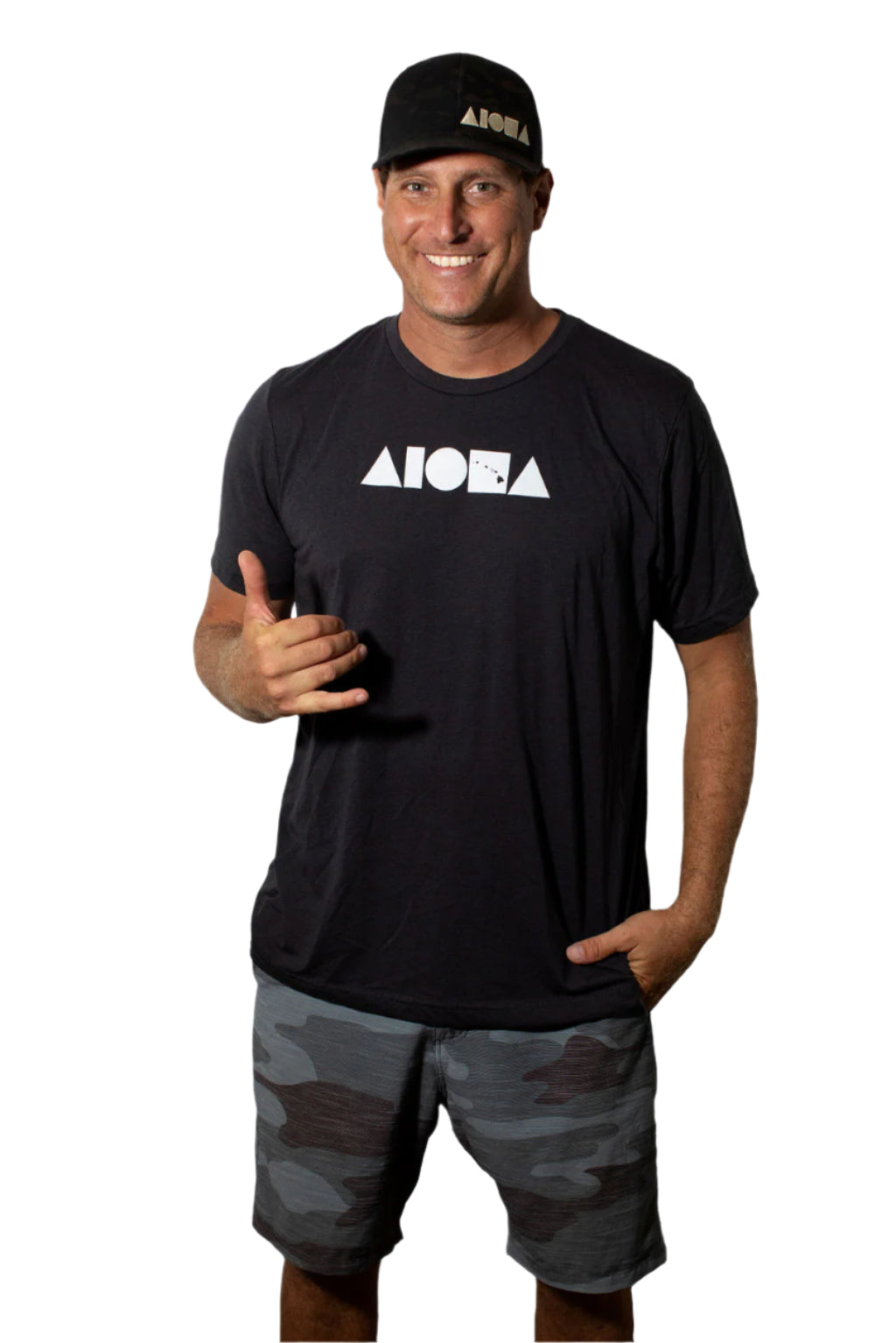 Man wearing Linton camo board shorts throwing shaka