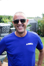 Man smiling wearing Navy Unisex Maui Circle Aloha Shapes tshirt