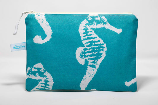 Wet/dry clutch size bag with turquoise seahorse pattern fabric handmade on Maui, Hawaii