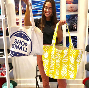 Girl holding a Hawaiian pineapple Oneloa canvas tote bag handmade in Maui Hawaii 