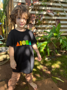 Young child wearing Rainbow Aloha Shapes youth t-shirt