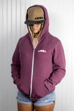 Blond deadlock girl wearing "Cork-o-nut" snapback and a zip-up Aloha Shapes ® hoodie