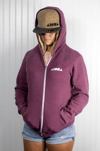 Blond deadlock girl wearing "Cork-o-nut" snapback and a zip-up Aloha Shapes ® hoodie