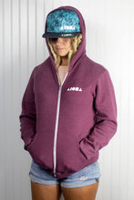 Blond dreadlocked girl wearing Aloha Shapes ® logo "Splatter" snapback hat and zip-up hoodie