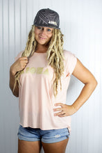 Blond dreadlocked girl wearing a "Tatau" Aloha Shapes ® logo snapback hat