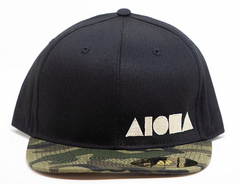 Black adult flat brim snapback hat embroidered with tan Aloha Shapes ® logo and a camo brim