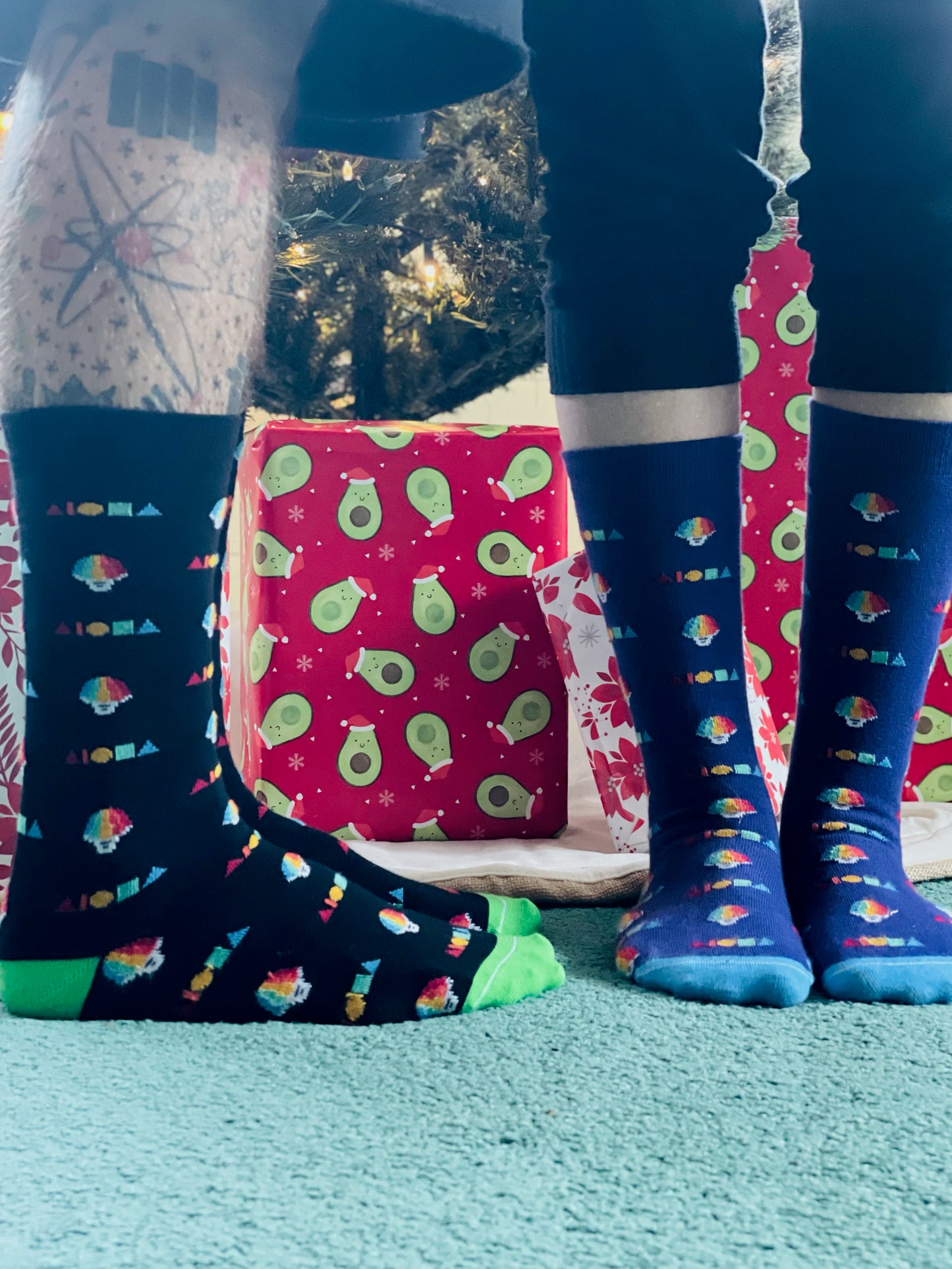 Cotton dress socks printed with alternating rainbow shave ice cups and Aloha shapes logos.