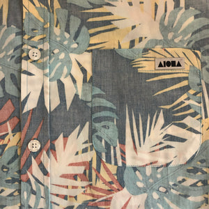 Closeup image of logo on pocket on Aloha Surf Shapes aloha shirt
