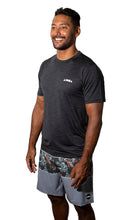 Man wearing short sleeve Aloha Surf Shapes sun shirt