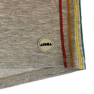closeup shot of woven Aloha Shapes® logo on label and colored stripe detail