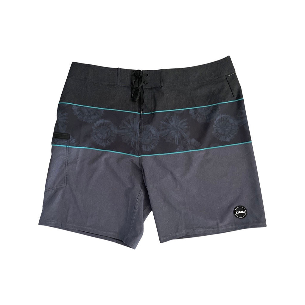 Adult unisex surf boardshorts with drawstring fly. Black and grey blocks with horizontal stripe of black/grey tide bordered by teal stripes