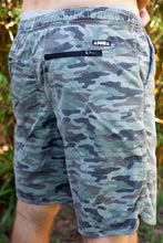 Man wearing Aloha Surf Shapes camo print "Loungin" sweat shorts in Maui Hawaii. Back view