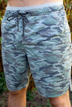 Man wearing Aloha Surf Shapes camo print "Loungin" sweat shorts in Maui Hawaii. Front view