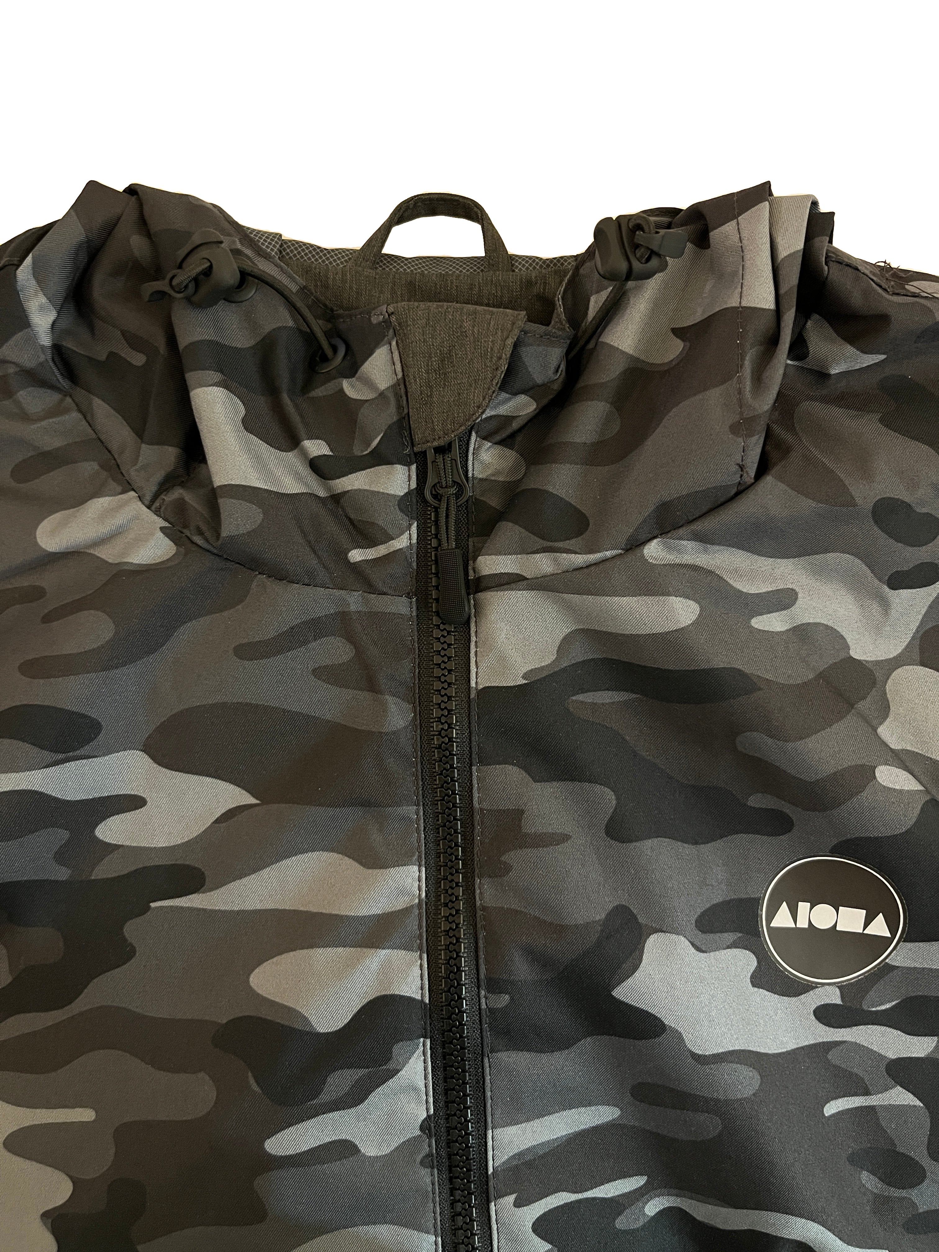 Closeup detail of neckline and Aloha Surf Shapes logo