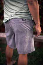Backside shot of adult "Nalu" board shorts with Aloha Shapes® logo detail