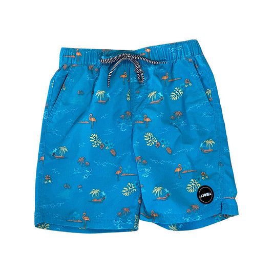 Youth elastic waist swim trunks. Blue fabric printed all over with flamingos and palm trees. Woven Aloha Surf Shapes logo. 