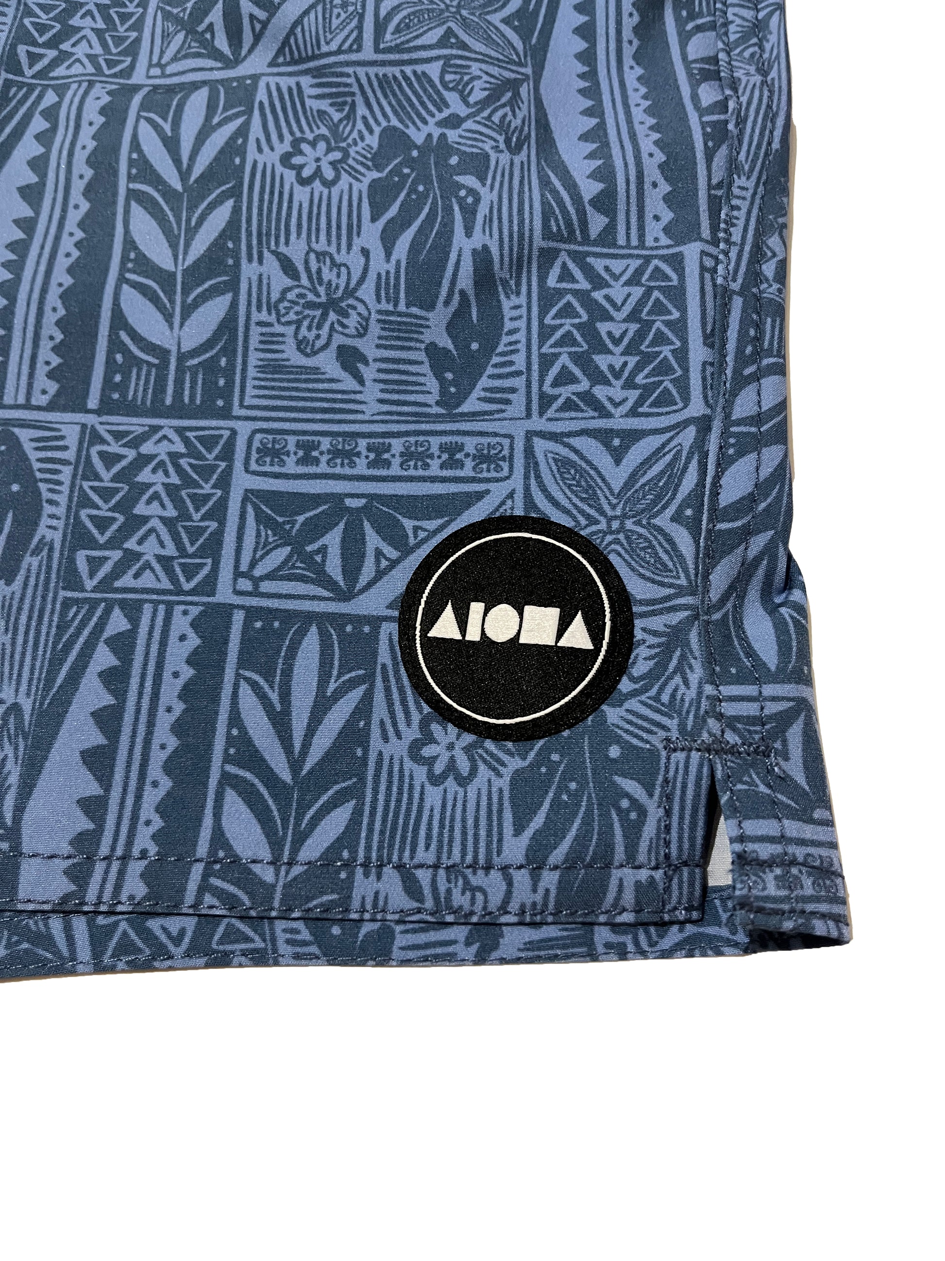 Closeup detail or woven fabric Aloha Surf Shapes logo