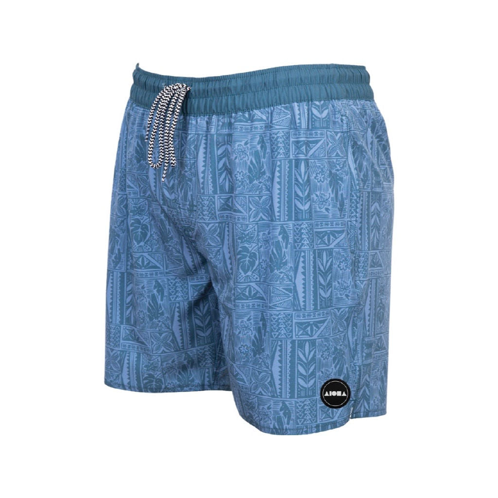 Adult swim trunks with elastic waistband and blue tropical tribal print. Aloha Surf Shapes woven fabric label on left bottom leg