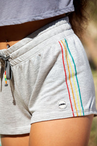 Closeup of grey "Laguna" womens shorts with rainbow stripe detail
