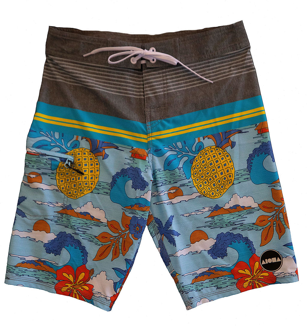 Boys youth boardshorts with tropical wave and pineapple pattern. Surf shorts have vinyl transfer Aloha Surf Shapes logo on left leg. 