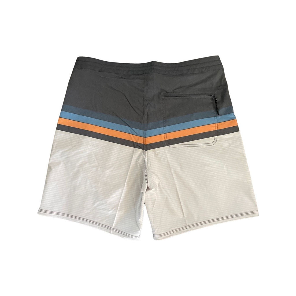 Back view of Adult surf shorts with grey waistband, horizontal blue and orange stripes and tan color legs. Aloha Surf Shapes fabric logo on left leg