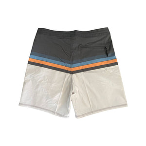 Back view of Adult surf shorts with grey waistband, horizontal blue and orange stripes and tan color legs. Aloha Surf Shapes fabric logo on left leg