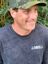 Man smiling wearing Aloha Warrior Shapes® longsleeve tee and camo hat. Maui Hawaii